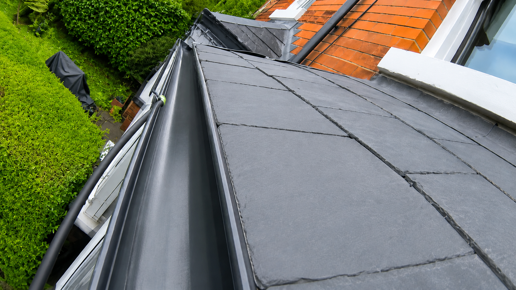 Post-clean gutter verification showing completely cleared channel